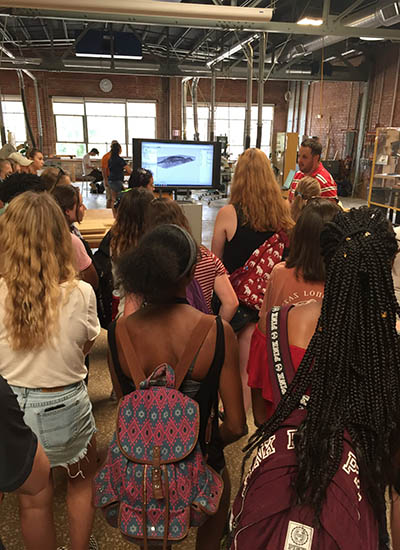 Students tour the Fabrication Lab with a UT College of Architecture and Design guide. 