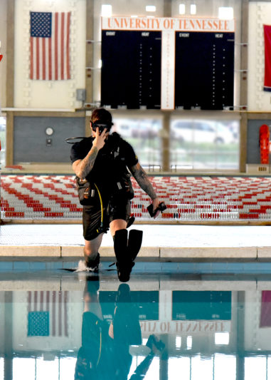 Navy Veteran, and former Navy Diver Alex Weber dives in the student Aquatic Center diving well.