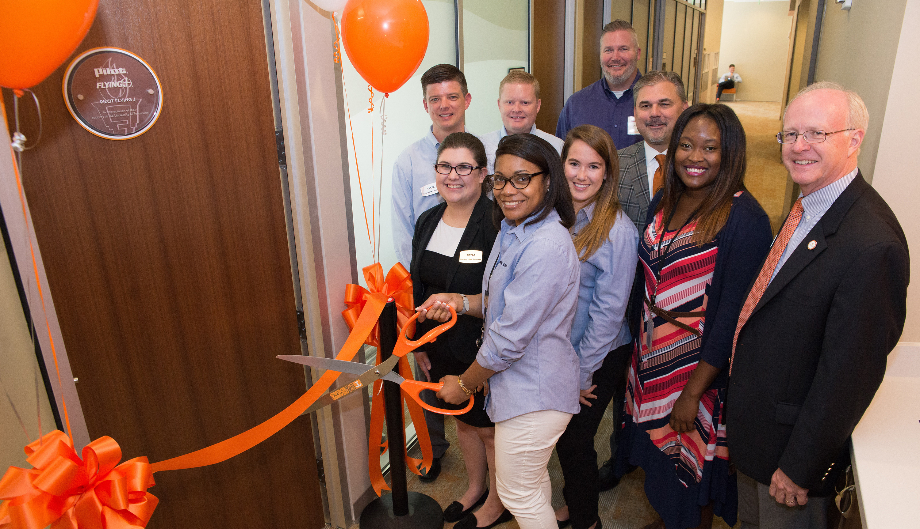 Front row: Pilot Flying J employees Kayla Dobbins, Carla Huff, Candace Hawkes, and Gerrica Caldwell, and Haslam College of Business Dean Steven Mangum. Second row: Pilot Flying J employees Tyler Williams, Andy Goodman, Erik Younger, and Vice President of Talent Acquisition Paul Shore.